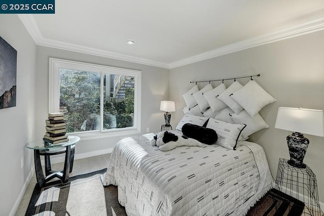 bedroom featuring crown molding and wood-type flooring