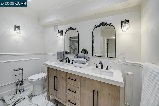 bathroom featuring crown molding, vanity, and toilet