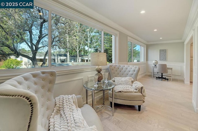 sunroom featuring a water view