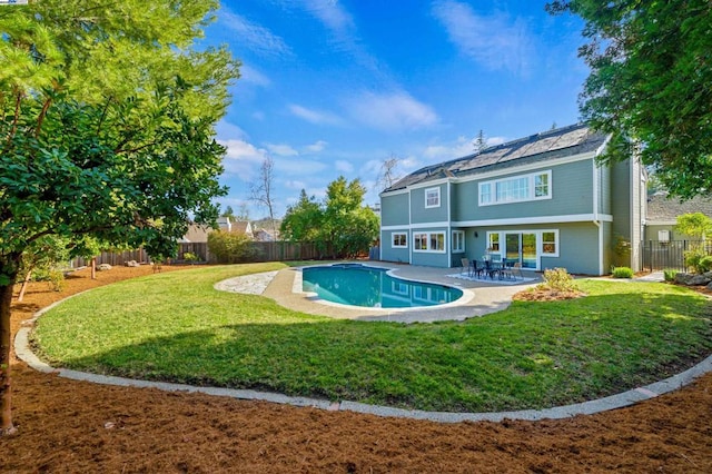 view of pool with a yard and a patio area