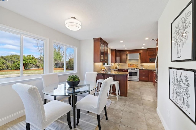 tiled dining area featuring sink