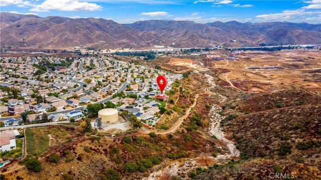 birds eye view of property with a mountain view and a residential view