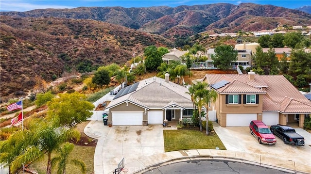 birds eye view of property featuring a mountain view