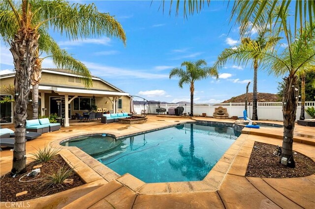 view of pool featuring an outdoor living space and a patio area