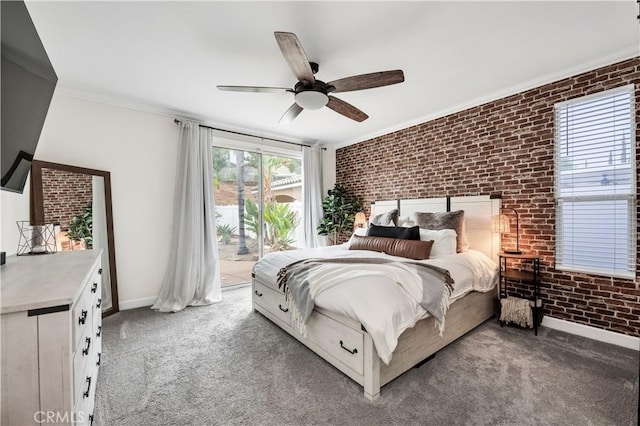 carpeted bedroom with access to exterior, ornamental molding, ceiling fan, and brick wall