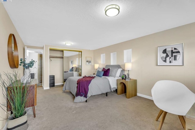 carpeted bedroom with a closet