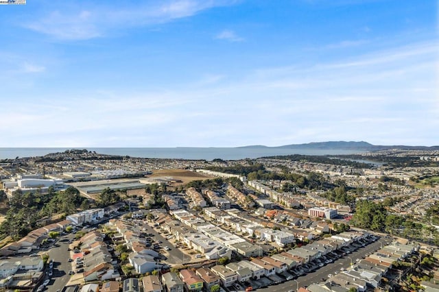 birds eye view of property featuring a water and mountain view