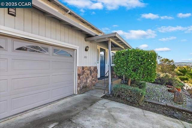 view of exterior entry featuring a garage