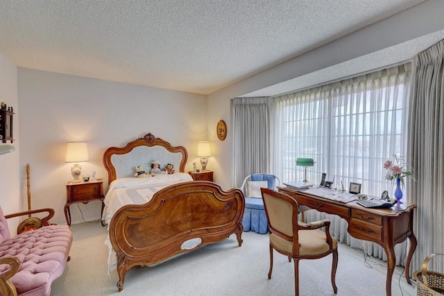 carpeted bedroom featuring a textured ceiling