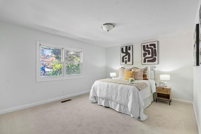 bedroom with light carpet