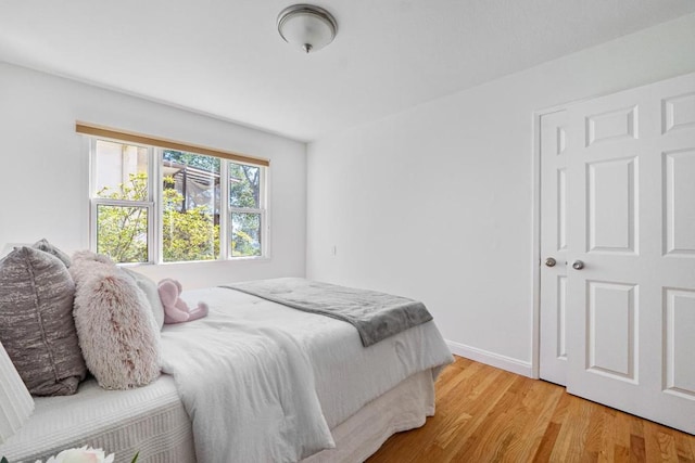 bedroom with light hardwood / wood-style floors