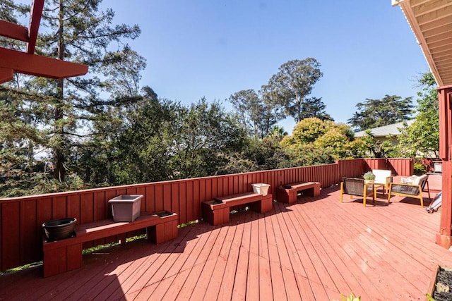 wooden terrace featuring an outdoor living space