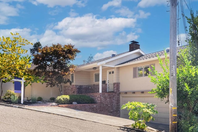 ranch-style home featuring a garage