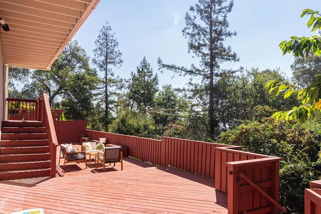 wooden deck featuring an outdoor hangout area