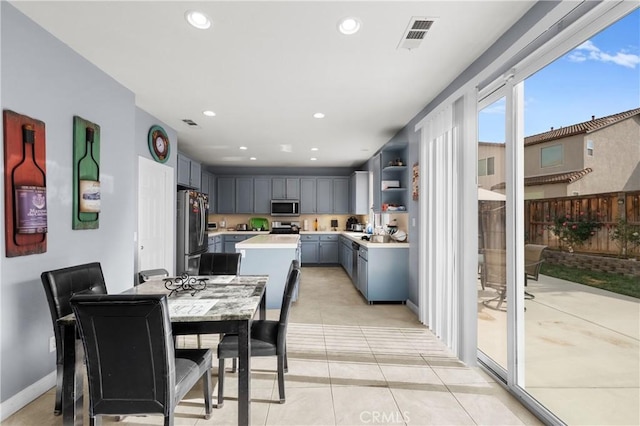 dining area featuring light tile patterned floors