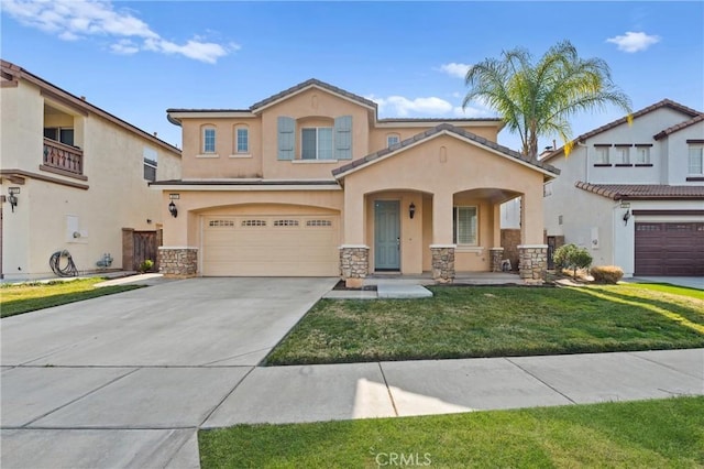 view of front of home featuring a garage and a front yard