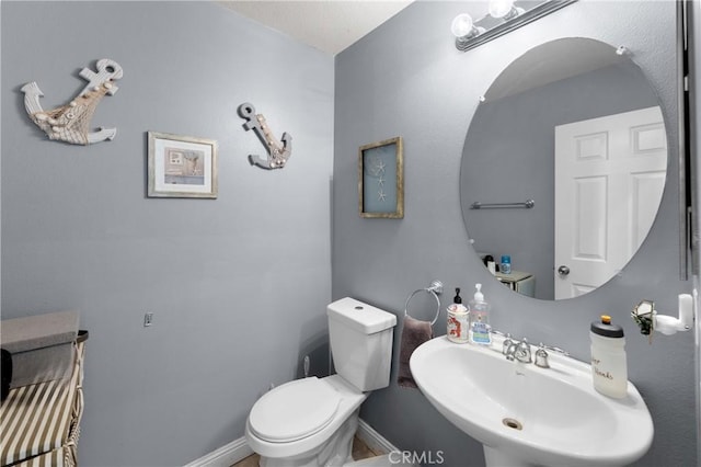 bathroom with toilet and sink