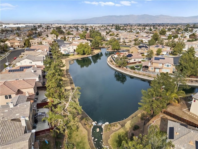 birds eye view of property featuring a water and mountain view