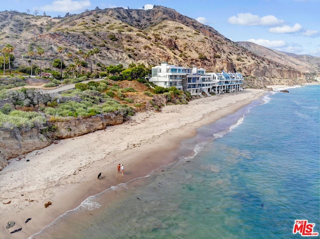 exterior space with a mountain view and a beach view