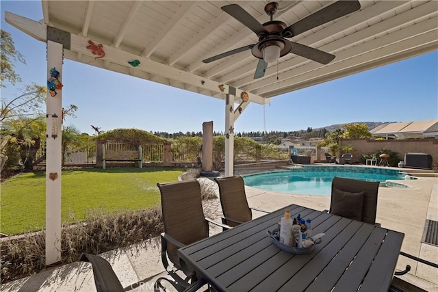 view of pool featuring ceiling fan, a patio area, and a lawn