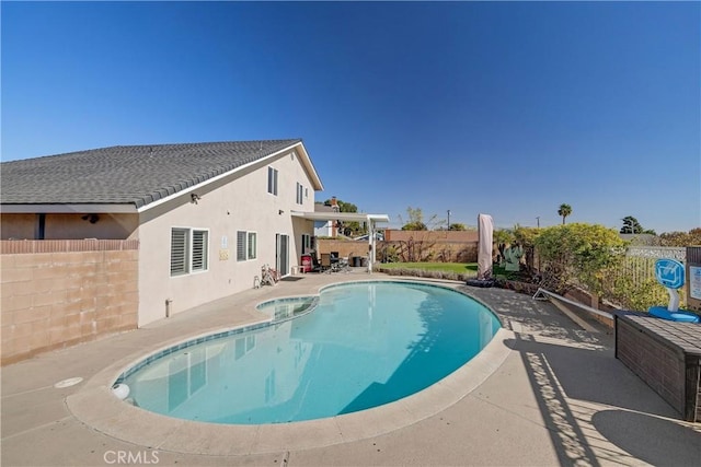 view of swimming pool with a patio area