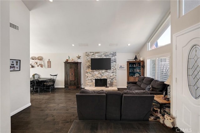 living room with lofted ceiling, dark hardwood / wood-style floors, and a fireplace