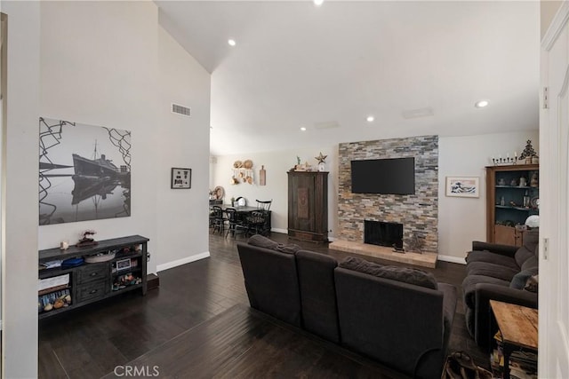 living room featuring dark hardwood / wood-style floors and a fireplace