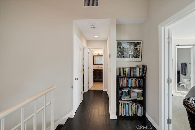 corridor with dark wood-type flooring