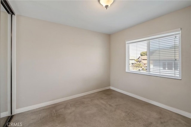 spare room featuring carpet flooring