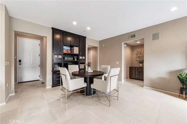 dining area featuring light tile patterned floors