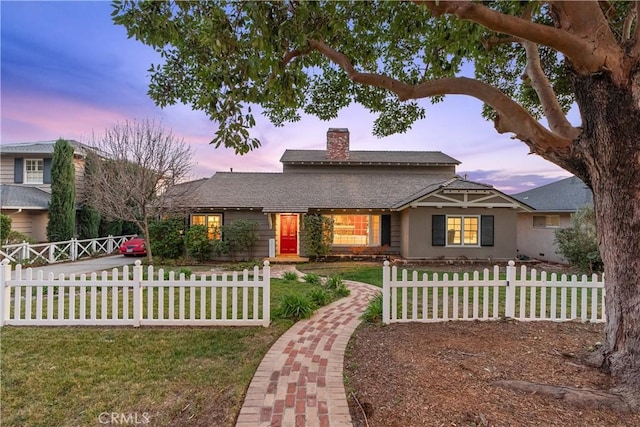 view of front of property with a lawn