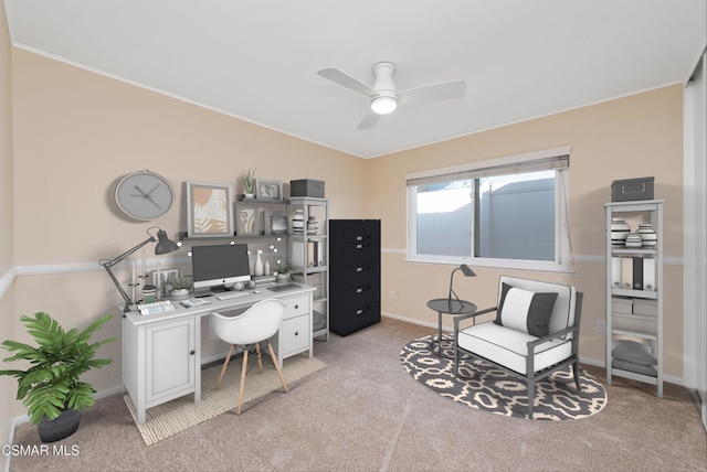 home office with ceiling fan and light carpet