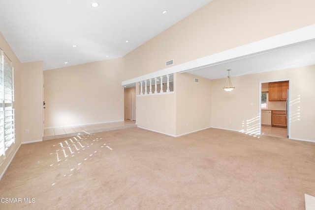 unfurnished living room with light carpet