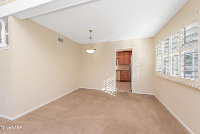 unfurnished room with light carpet