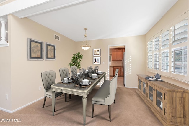 dining room with light carpet