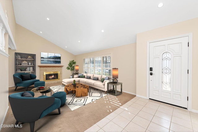 tiled living room with a fireplace and high vaulted ceiling