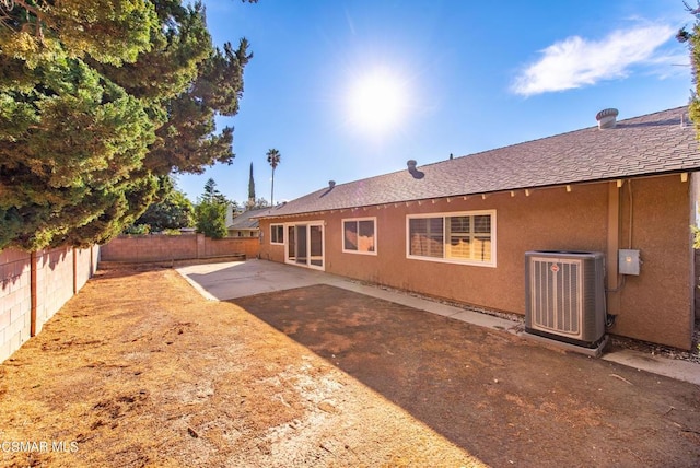 back of property featuring a patio and central air condition unit