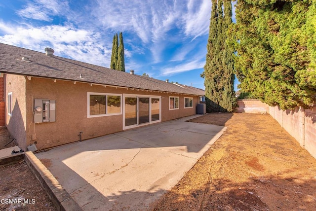 back of house featuring a patio and cooling unit