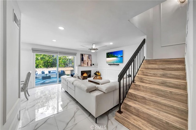 living room featuring ceiling fan