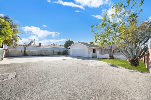 ranch-style house featuring a garage