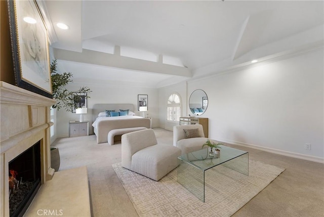 bedroom featuring lofted ceiling, light carpet, and a high end fireplace