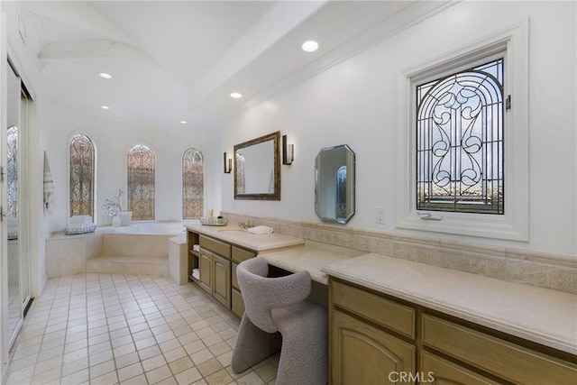 bathroom with a relaxing tiled tub, vanity, tile patterned floors, and ornamental molding