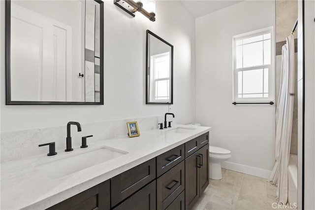 full bathroom featuring vanity, tile patterned floors, toilet, and shower / bathtub combination with curtain