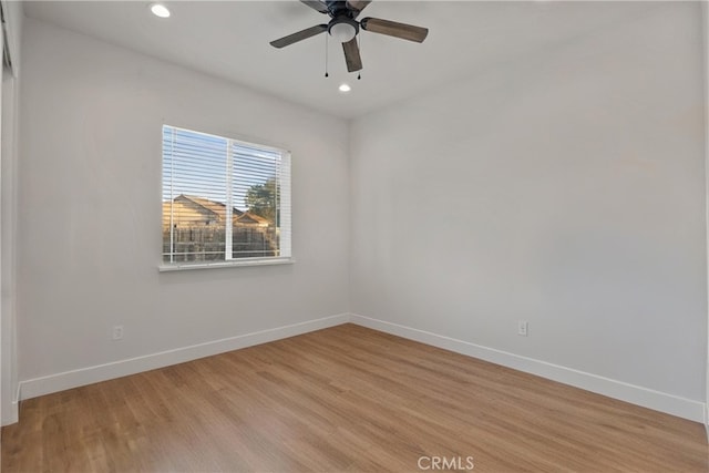 unfurnished room featuring ceiling fan and light wood-type flooring