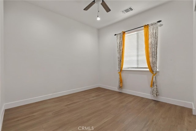 spare room with ceiling fan and light hardwood / wood-style floors