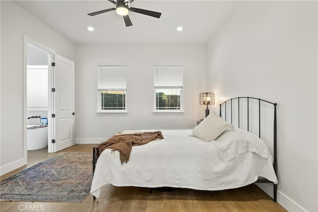 bedroom with hardwood / wood-style floors and ceiling fan