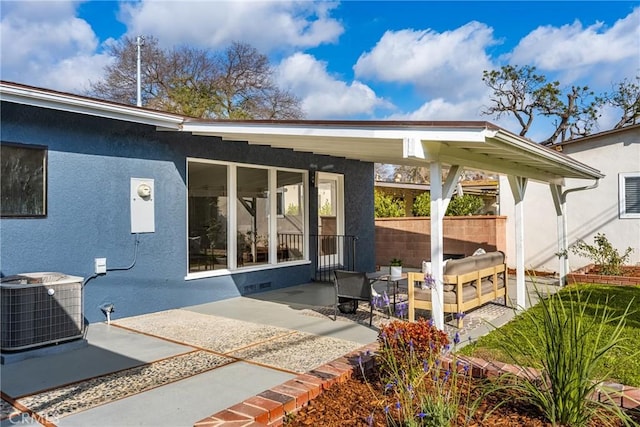 rear view of property with a patio and cooling unit