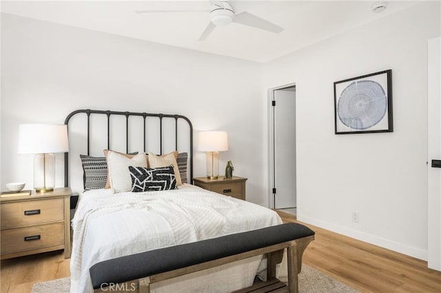 bedroom featuring light hardwood / wood-style floors and ceiling fan