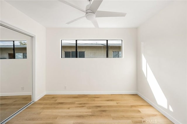 spare room with ceiling fan and light hardwood / wood-style flooring