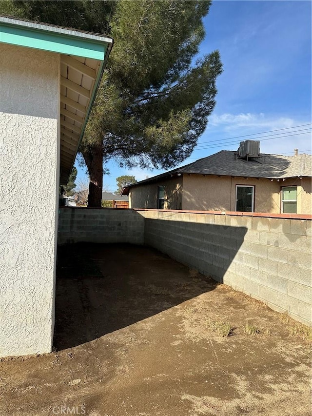 view of side of home with cooling unit